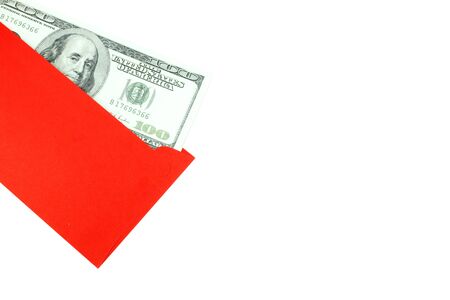 Money 100 Us dollar bills in a red envelope at white background, The concept Ang Pao or Chin Sok of Chinese New Yearの写真素材