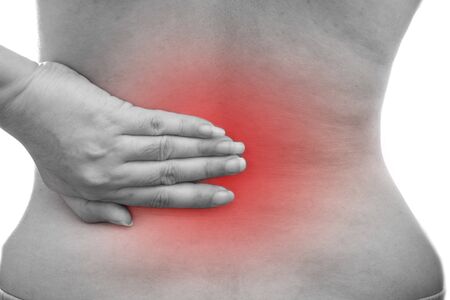 Young Asian woman with back pain at white background, Health problem discomfort concept