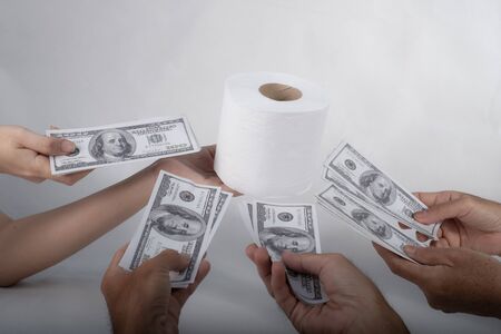Close up sell buy tissue, hand holds toilet paper tissue and money of 100 US dollars banknote a lot...