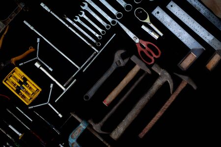Photo top view a huge set collection of working hand and power tools many for the wooden on black background, Toolset with interior,  do-it-yourself  DIY tool, kit flat style, Stock hardwareの写真素材
