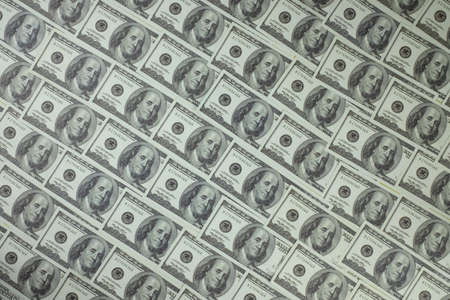 Group of money stack of 100 US dollars banknotes a lot of is arranged in a beautifulの写真素材