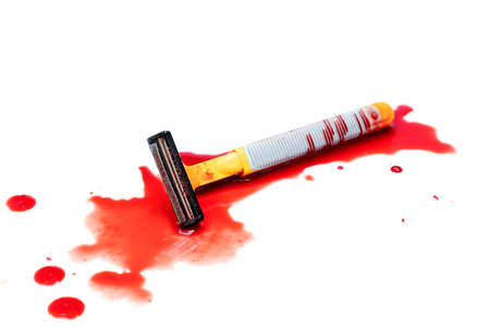 Razor bloody and drop blood on white backgroundの写真素材