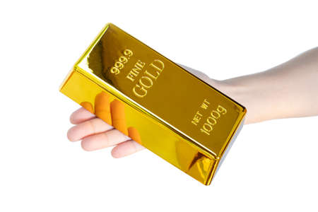 Human hand holding gold bar 1kg on white background
