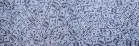 Group of money stack of 100 US dollars banknotes a lot of the background texture
