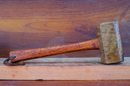 Set of mallet hammer wood made of Padauk wood and tool handmade of Thailand for use by a carpenter in the workshop on the old workbenchの写真素材