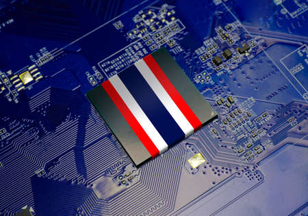 Thai National Flag on CPU operating chipset computer electronic circuit board, Thailand technology or hardware development related conceptualの写真素材