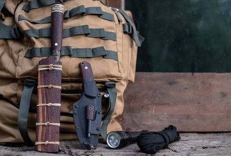 A knife with equipment for survival in the forestの写真素材