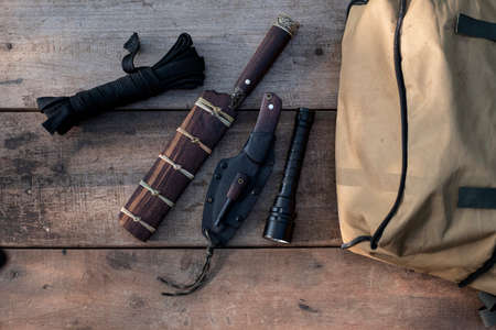 A knife with equipment for survival in the forestの写真素材