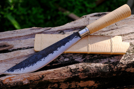 E-nep knife Thai native Knives for survival in the forest on an old timber woodenの写真素材