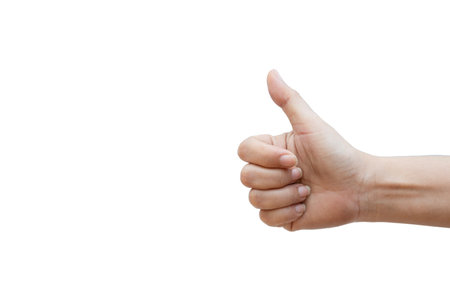 Human hand giving a thumbs up on white backgroundの写真素材