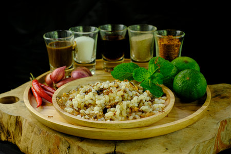 Red ant egg with flavoring for a spicy salad, The local food of Thailand the northeastern region, black backgroundの写真素材