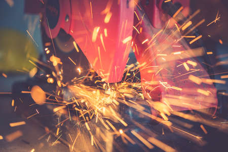 Cutting of a steel with splashes of sparksの写真素材