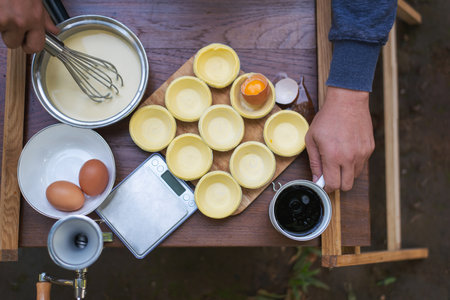 Delicious homemade crispy egg tart with creamy,sweet and succulent egg custard filling / Egg Tart / Made with fresh eggs,shop bought pastry for crust,pre-bake pastry in mold,filled egg blends and bakeの写真素材