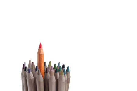 Red pencil standing out from others,One sharpened pencil standing out from the other pencil.の写真素材