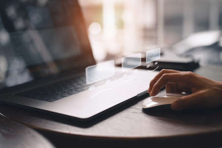 Business woman pressing face emoticon on the keyboard laptop and checklist service report on online shop ,Customer service evaluation concept.の写真素材