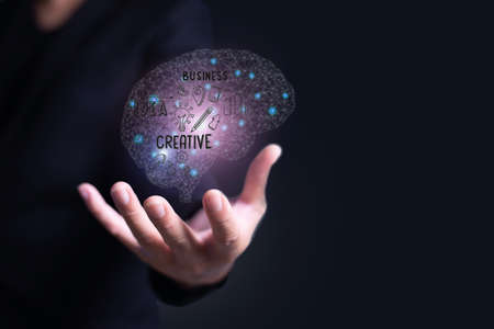 Businessman hand holding brain, Artificial Intelligence, AI Technology, creative concept,copy space...