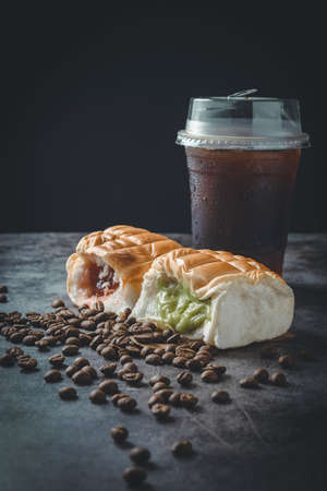 Coffee americano, fresh buns and jam. Simple breakfast in morning,copy space for text.