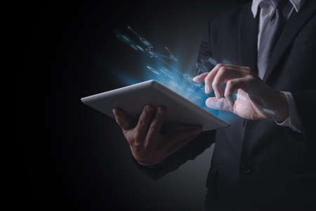 Business technology, IoT Internet of Things, Software development concept. Business man, working on digital tablet, laptop computer. Coding programmer developing mobile apps. Web icons, computer codeの写真素材