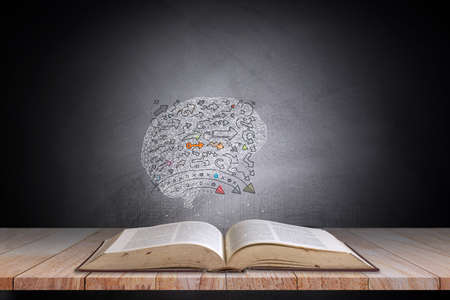 Book and brain icon dark background,Concept The idea of reading books, knowledge, and searching for new ideas.の写真素材