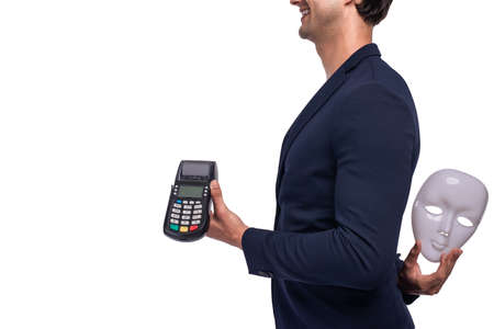 Businessman holding payment terminal on white background and left hand hide sly mask in behind of...