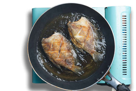 Dried salted gourami, Deep fried crispy fish thai food., crispy gourami fried fish on pan.の写真素材