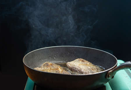 Dried salted gourami, Deep fried crispy fish thai food., crispy gourami fried fish on pan.の写真素材