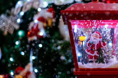 Toy Santa Claus stand in snow light, Christmas card, New Year decoration, go to winter timeの写真素材