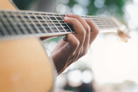 Soft focus,Man playing classic, acoustic guitar