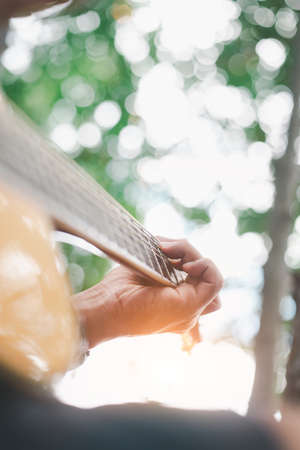 Soft focus,Man playing classic, acoustic guitar