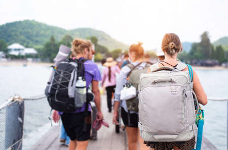 Travel people with backpack waiting ship in the port, Man traveler with backpack standing outdoors...