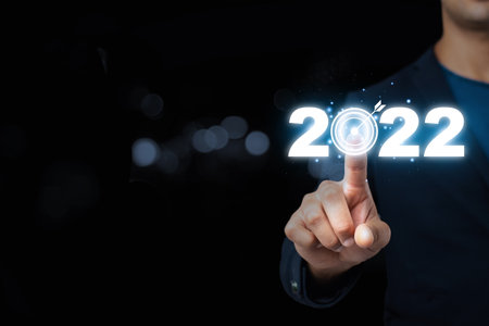 Businessman hand pointing in the new year 2022.,Business development and growth concept.business...