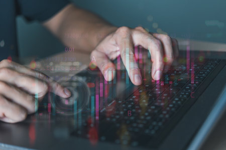 A businessman is using a laptop and taking notes. an interactive digital globe of the earth glowing hud and hologram. Business marketing theoryの写真素材