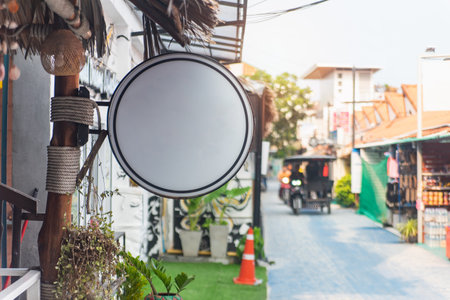 mockup of a circle with a street business template signboard on a blank Â wallの写真素材