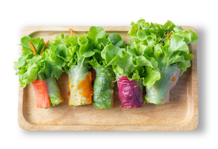 Salad with mixed crab, pork, and vegetables in a tube in a close-up on a white background of a cutting board.の写真素材
