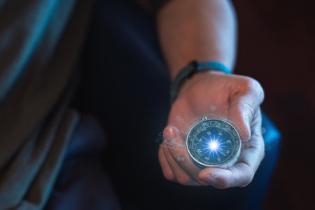 entrepreneur holding a compass in his hand. Define your marketing strategy and look for global customer networks.の写真素材