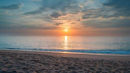 beach with sea sand. panoramic view of a beach. inspiring horizon of a tropical beach. Sunset sky that is calm, peaceful, and golden, with a summertime feel. holiday travel banner for vacationの写真素材