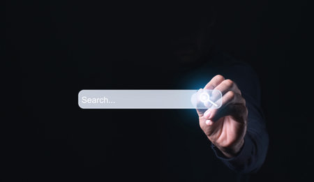 Internet search page being clicked on a computer's touch screen by a businessman while searching the internet is shown in the concept of information networking and data sharing. - Imageの写真素材
