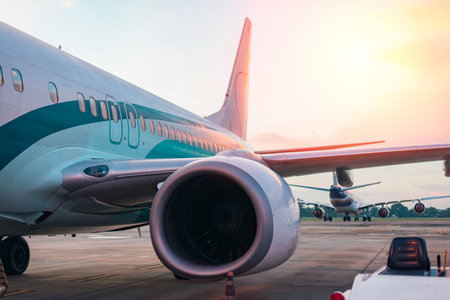 An aircraft at the terminal gate, ready for flight - Sunset at a contemporary international airport