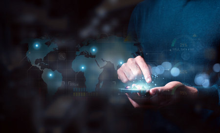 A businessman interacts with a futuristic global data network hologram projected from his...