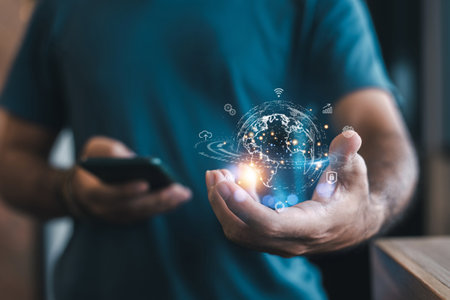 A man holding a glowing digital globe in his hand, symbolizing global connectivity and technology,...