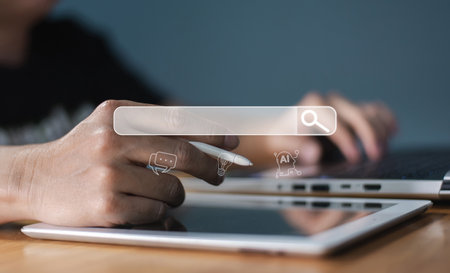 Close-up of a hand using a stylus on a tablet, with a transparent search bar overlay and AI-related...