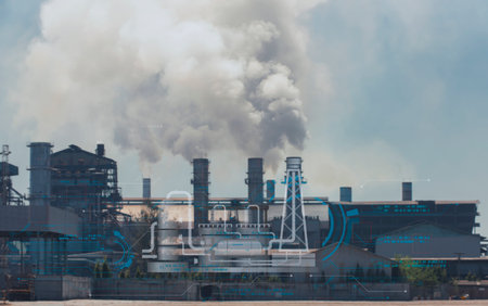 Industrial factory chimneys emitting smoke with digital technology hologram. Concept of smart industry, pollution monitoring, and environmental analysis.の写真素材