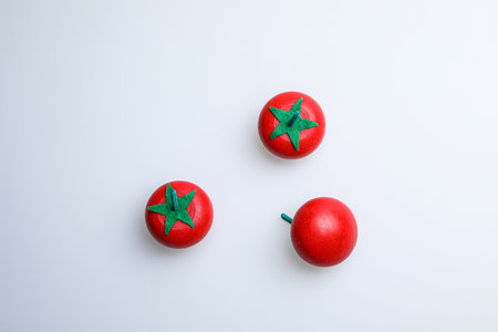 Red tomatoes with green star on white background. Flat lay, top viewの写真素材