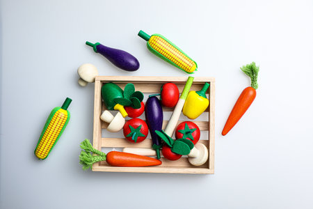 Vegetables in a wooden box on a white background, top viewの写真素材