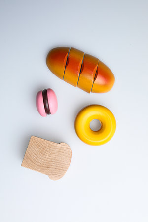 Wooden toys on white background. Top view. Flat lay.の写真素材