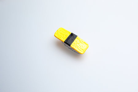 yellow and black eraser isolated on white background with copy space.の写真素材