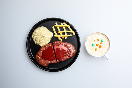 Cup of coffee and hamburger on white background, top viewの写真素材