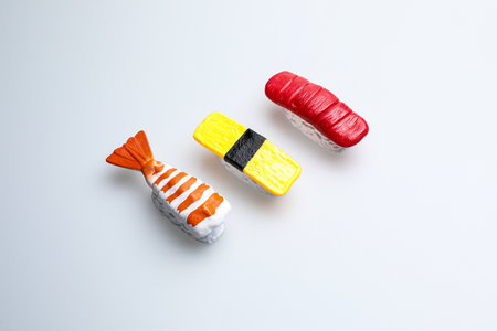 Colorful candies in the form of fish on a white backgroundの写真素材