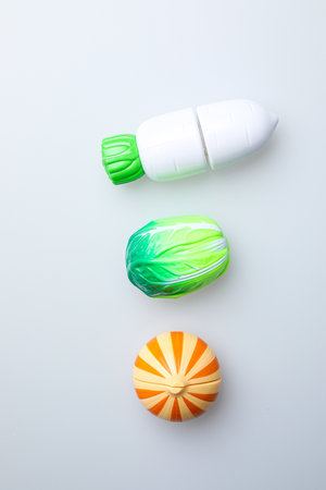 Colorful plastic toys on white background. Top view. Flat lay.の写真素材