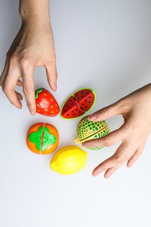 Easter eggs painted in watermelon and lemon on a white backgroundの写真素材